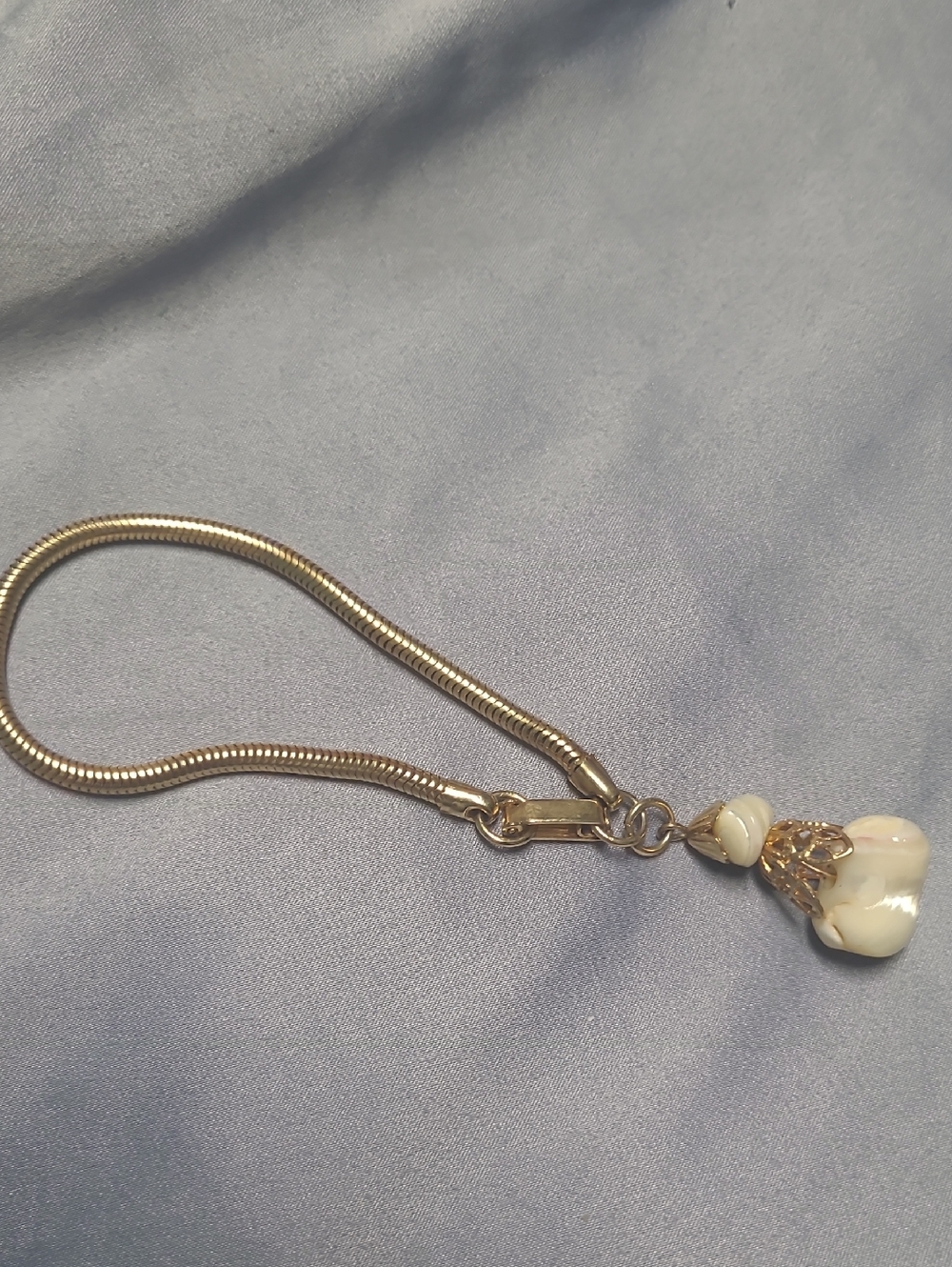 Gold-Tone Snake Chain Bracelet with Cream Shell Charm